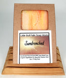 A handcrafted Sundrenched Goat Milk Soap bar with a luxurious lather, made with organic oils, raw goat milk, and skin-loving butters. Infused with a vibrant sugared citrus and tropical fruit scent, featuring notes of oranges, lemons, limes, and exotic greens. Cold-processed for a long-lasting, nourishing cleanse. Handmade, natural, paraben-free, phthalate-free, and perfect for all skin types. Elevate your self-care routine with this beautifully scented artisan soap!