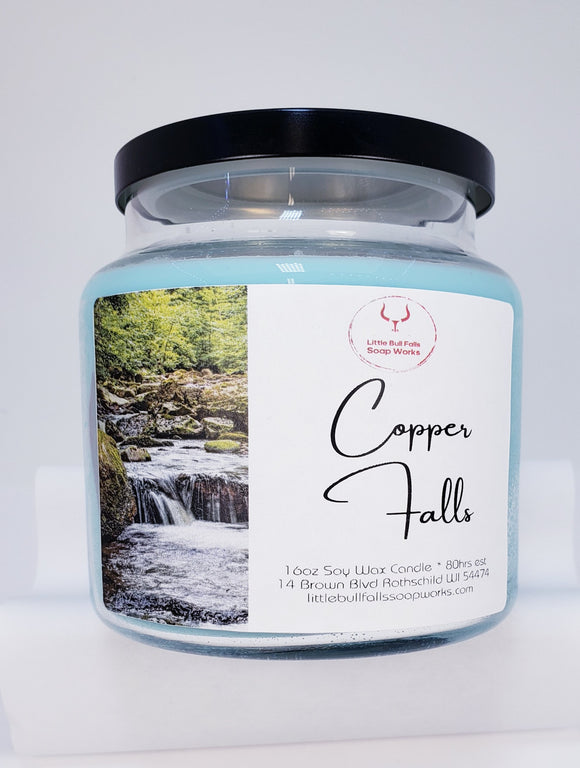 Copper Falls is an all-natural biodegradable soy wax candle made from soybeans grown in the United States. It also sports a wood wick. It is made in Wisconsin by Little Bull Falls Soap Works. Amber Waters fragrance oil is a woodsy, sexy, masculine aroma with top notes of pink grapefruit, Italian bergamot, and red berries, followed by middle notes of white lilies, lavender, and a marine accord; sitting on base notes of golden amber, patchouli, and guaiac wood. 