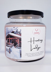 Hunting Lodge soy wax candle with a wooden wick. Handmade & handpoured in Wisconsin by Little Bull Falls Soap Works. Makes a great gift for a man. Hunting Lodge is a masculine, woodsy scent that is calming and upscale.  This scent begins with top notes of smoky mohogany and crystal amber, followed by middle notes of star jasmine, clove leaf, and soft cashmere; sitting on masculine base notes of sweet tobacco, tonka bean, and white musk. 