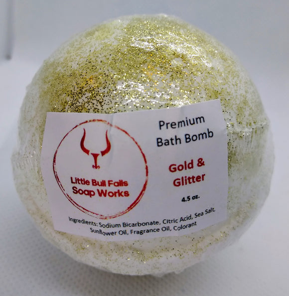 Gold & glitter orange citrus bath bomb by Little Bull Falls Soap Works a bath bomb company in Wisconsin who also does wholesale